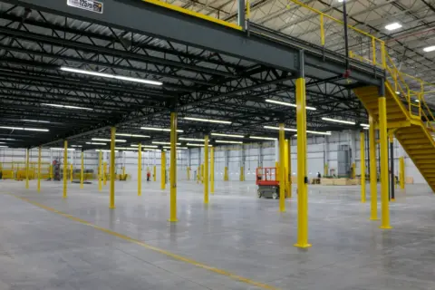 Beam sub-flooring for mezzanine